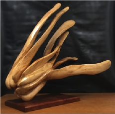 An abstract woodcarving of an imaginary creature in fight or flight mode