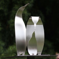 Stainless steel sculpture of family of Emperor penguins